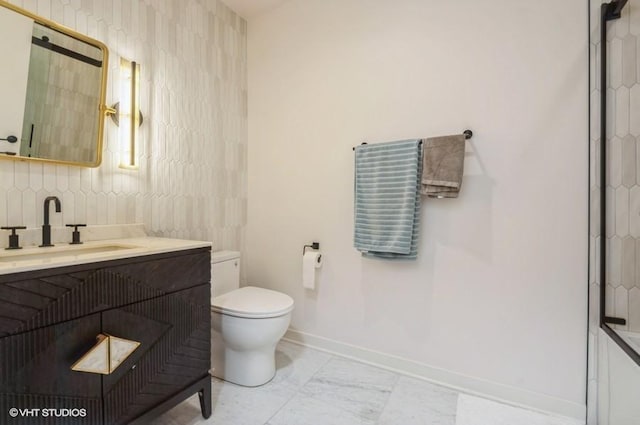 600 N Fairbanks Ct Unit 1707, Chicago, IL 60611 - full bath featuring toilet, vanity, baseboards, and marble look tiles