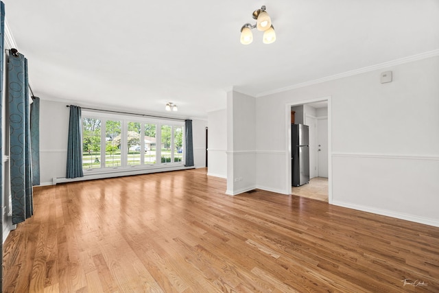 805 N Delphia Ave, Park Ridge, IL 60068 - empty room featuring crown molding, light wood-style flooring, baseboards, and baseboard heating