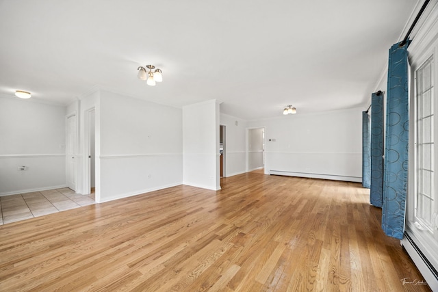 805 N Delphia Ave, Park Ridge, IL 60068 - empty room with a baseboard radiator, light wood finished floors, crown molding, and baseboards