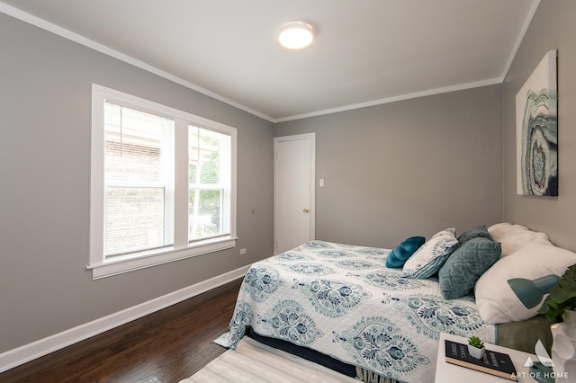 12480 S Wabash Ave, Chicago, IL 60628 - bedroom featuring dark wood finished floors, crown molding, and baseboards
