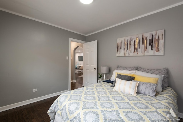 12480 S Wabash Ave, Chicago, IL 60628 - bedroom featuring crown molding, dark wood finished floors, baseboards, and arched walkways