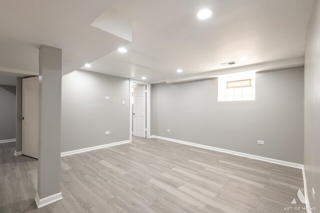 12480 S Wabash Ave, Chicago, IL 60628 - basement with light wood finished floors, baseboards, and recessed lighting