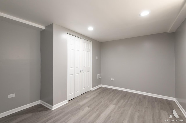 12480 S Wabash Ave, Chicago, IL 60628 - unfurnished bedroom featuring wood finished floors, recessed lighting, baseboards, and a closet
