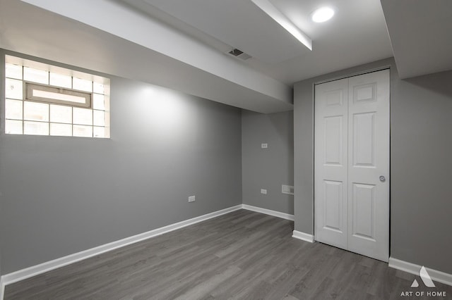 12480 S Wabash Ave, Chicago, IL 60628 - below grade area featuring dark wood-style floors and baseboards