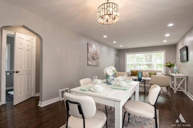 12480 S Wabash Ave, Chicago, IL 60628 - dining room with arched walkways, dark wood finished floors, baseboards, and recessed lighting