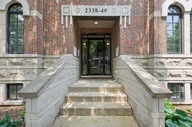 2338 W Roscoe St Unit 2E, Chicago, IL 60618 - property entrance with brick siding
