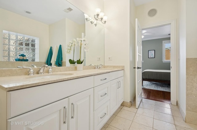 2338 W Roscoe St Unit 2E, Chicago, IL 60618 - ensuite bathroom with double vanity, healthy amount of natural light, and tile patterned floors