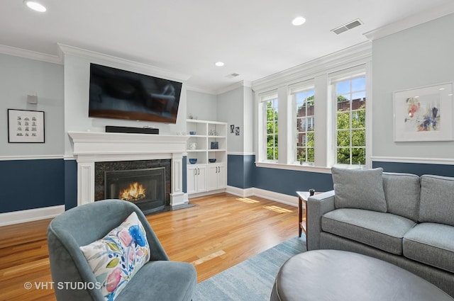 2338 W Roscoe St Unit 2E, Chicago, IL 60618 - living area featuring wood finished floors, ornamental molding, recessed lighting, and a premium fireplace