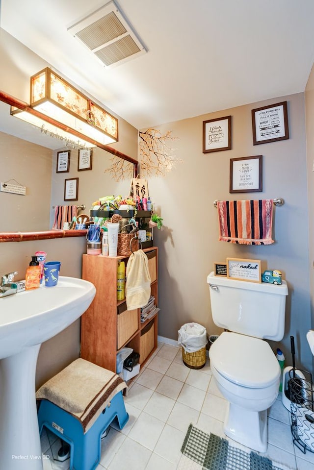 222 Oakwood Ln, Bloomingdale, IL 60108 - bathroom featuring toilet and tile patterned floors
