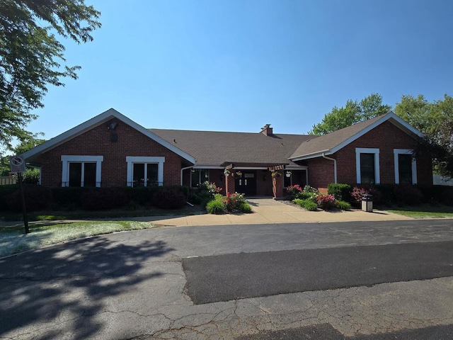 222 Oakwood Ln, Bloomingdale, IL 60108 - ranch-style home with brick siding and a chimney