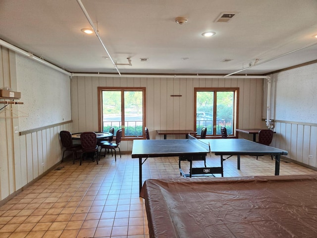 222 Oakwood Ln, Bloomingdale, IL 60108 - recreation room with healthy amount of natural light, light tile patterned flooring, and wainscoting