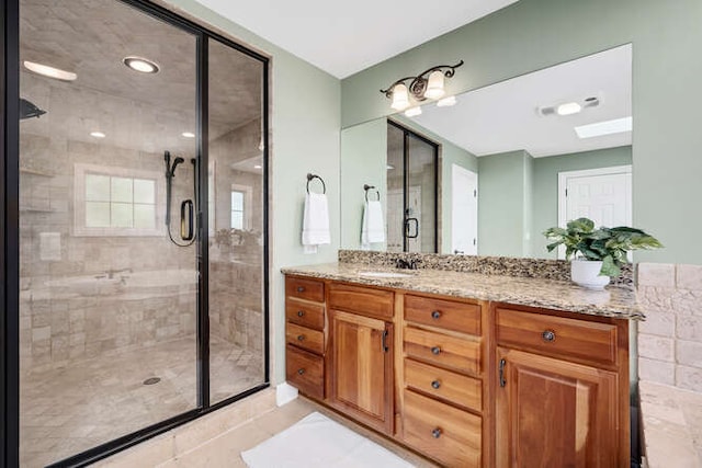 808 Maple Ave, Downers Grove, IL 60515 - full bathroom featuring vanity, a stall shower, a skylight, and tile patterned floors