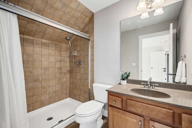 808 Maple Ave, Downers Grove, IL 60515 - bathroom featuring toilet, tiled shower, and vanity