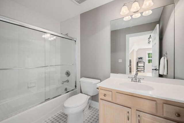 808 Maple Ave, Downers Grove, IL 60515 - full bathroom with toilet, vanity, bath / shower combo with glass door, and baseboards