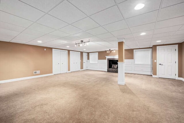 808 Maple Ave, Downers Grove, IL 60515 - unfurnished living room featuring light colored carpet, a fireplace, baseboards, a paneled ceiling, and recessed lighting