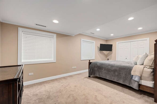 808 Maple Ave, Downers Grove, IL 60515 - bedroom with baseboards, light carpet, recessed lighting, crown molding, and a closet