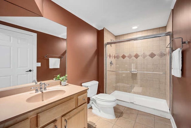 808 Maple Ave, Downers Grove, IL 60515 - bathroom featuring toilet, tile patterned floors, a shower stall, vanity, and baseboards