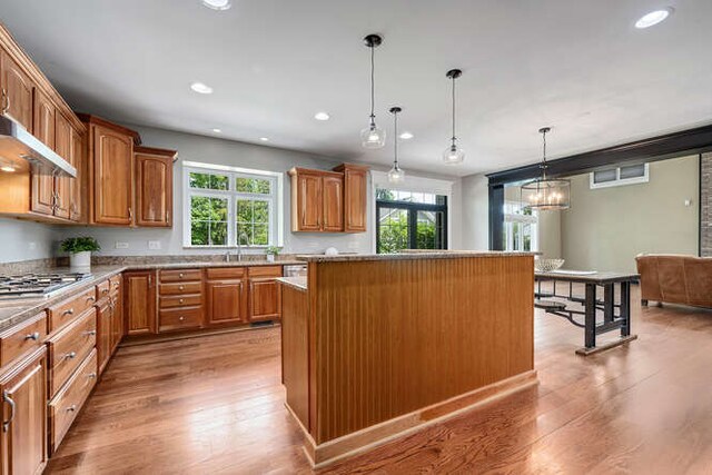 808 Maple Ave, Downers Grove, IL 60515 - kitchen featuring a kitchen island, stainless steel gas cooktop, plenty of natural light, light wood-style floors, and recessed lighting