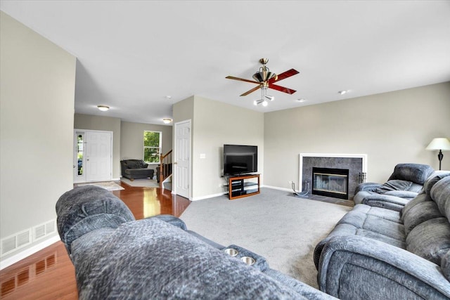 2585 Lambert Dr, Aurora, IL 60503 - living room featuring ceiling fan, a high end fireplace, and carpet