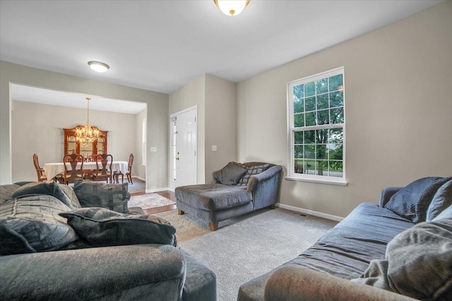 2585 Lambert Dr, Aurora, IL 60503 - living room featuring a chandelier and carpet