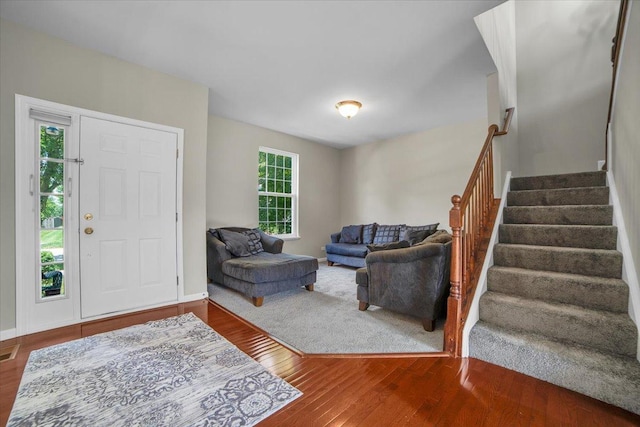 2585 Lambert Dr, Aurora, IL 60503 - foyer with plenty of natural light, stairs, and wood finished floors
