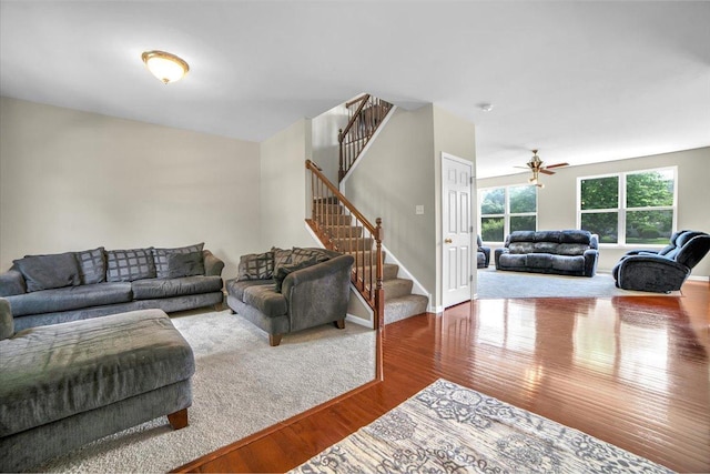 2585 Lambert Dr, Aurora, IL 60503 - living room with wood finished floors, stairway, and a ceiling fan