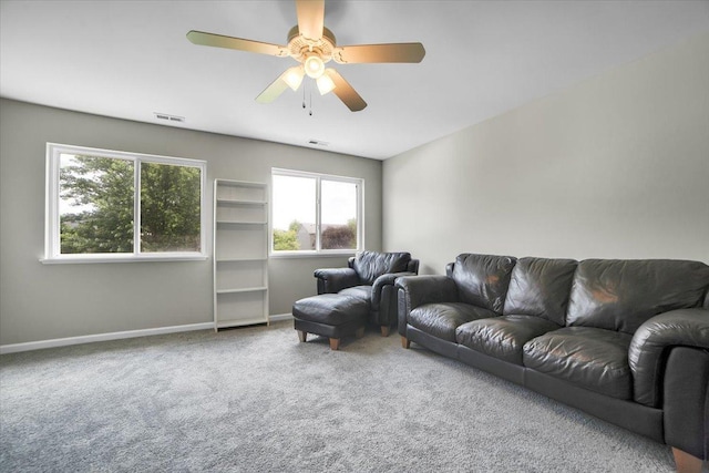 2585 Lambert Dr, Aurora, IL 60503 - carpeted living room featuring baseboards and a ceiling fan