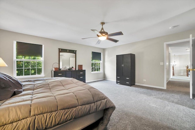 2585 Lambert Dr, Aurora, IL 60503 - carpeted bedroom featuring baseboards and ceiling fan