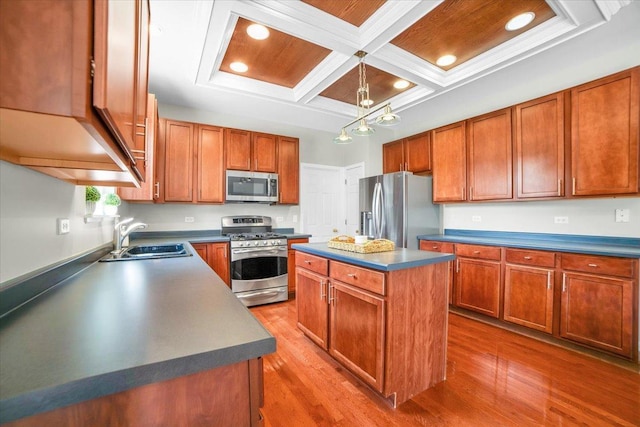 2585 Lambert Dr, Aurora, IL 60503 - kitchen featuring appliances with stainless steel finishes, coffered ceiling, dark countertops, a center island, and wood finished floors