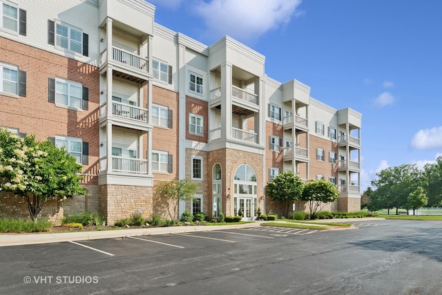 3975 Idlewild Ln Unit 200, Naperville, IL 60564 - view of apartment building / complex featuring uncovered parking