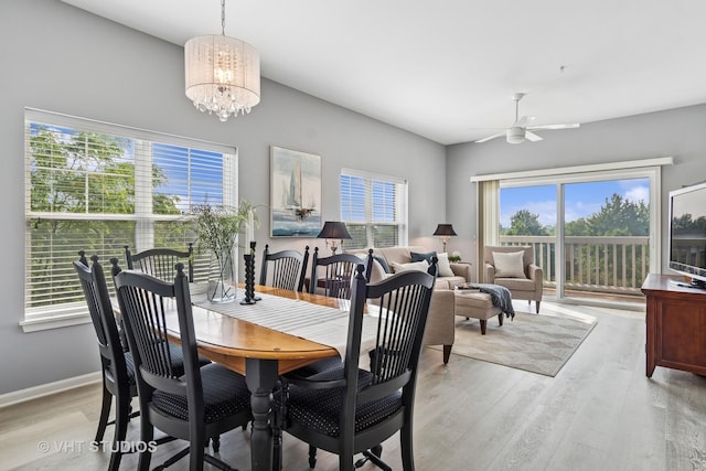 3975 Idlewild Ln Unit 200, Naperville, IL 60564 - dining area with light wood-style flooring, a chandelier, a ceiling fan, and baseboards