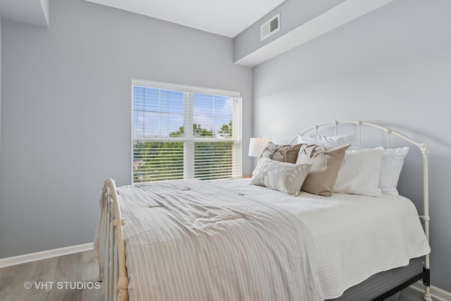 3975 Idlewild Ln Unit 200, Naperville, IL 60564 - bedroom featuring wood finished floors and baseboards