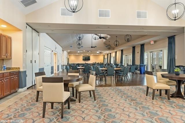 3975 Idlewild Ln Unit 200, Naperville, IL 60564 - dining space with a chandelier and high vaulted ceiling