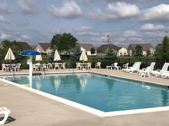 3975 Idlewild Ln Unit 200, Naperville, IL 60564 - community pool featuring a patio area and a residential view