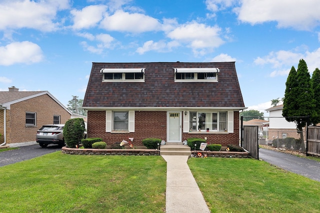 10608 Moody Ave, Chicago Ridge, IL 60415 - view of front of home with a shingled roof, brick siding, and mansard roof