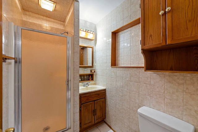 10608 Moody Ave, Chicago Ridge, IL 60415 - full bathroom with a stall shower, vanity, toilet, tile walls, and tile patterned flooring