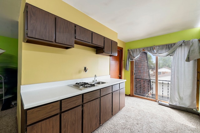 10608 Moody Ave, Chicago Ridge, IL 60415 - kitchen featuring light carpet, light countertops, dark brown cabinetry, and a sink