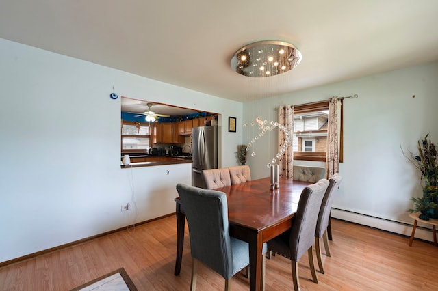 10608 Moody Ave, Chicago Ridge, IL 60415 - dining space with healthy amount of natural light, light wood-style floors, baseboard heating, and a ceiling fan