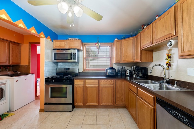 10608 Moody Ave, Chicago Ridge, IL 60415 - kitchen featuring stainless steel appliances, washer and clothes dryer, a sink, and light tile patterned floors