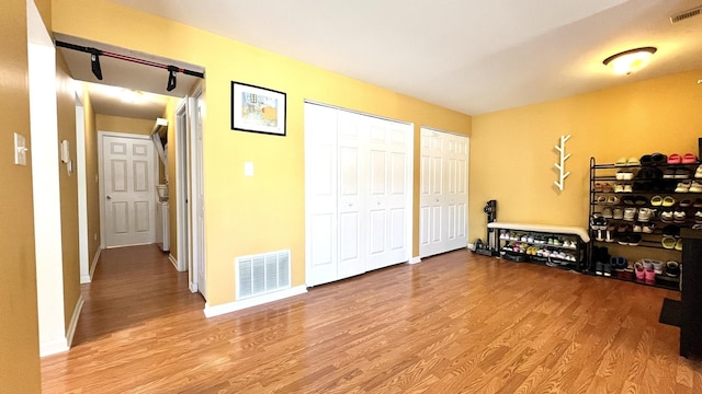 2254 N Baldwin Way Unit 4A, Palatine, IL 60074 - interior space with multiple closets and light wood-type flooring