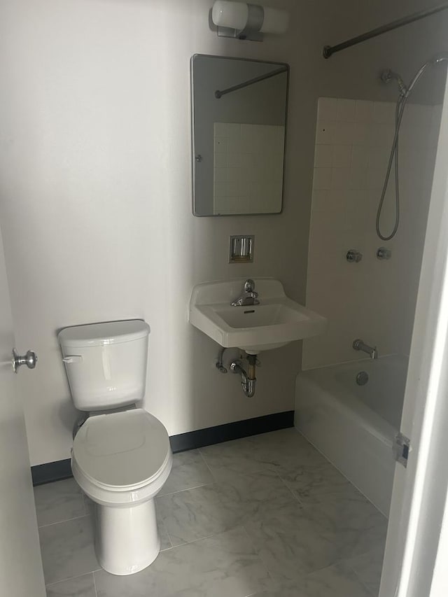 bathroom featuring shower / bathtub combination and marble look tiles