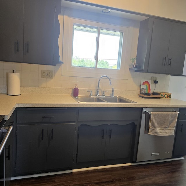 421 W 1st St, Stillman Valley, IL 61084 - kitchen featuring a sink, stainless steel dishwasher, range, backsplash, and light countertops