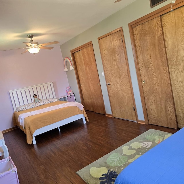 421 W 1st St, Stillman Valley, IL 61084 - bedroom featuring wood finished floors, multiple closets, and baseboards