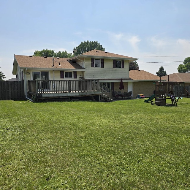 421 W 1st St, Stillman Valley, IL 61084 - rear view of house with a playground, a deck, and a shingled roof