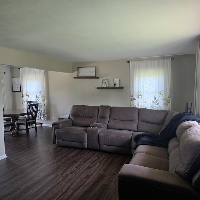 421 W 1st St, Stillman Valley, IL 61084 - living room with dark wood finished floors, healthy amount of natural light, and baseboards