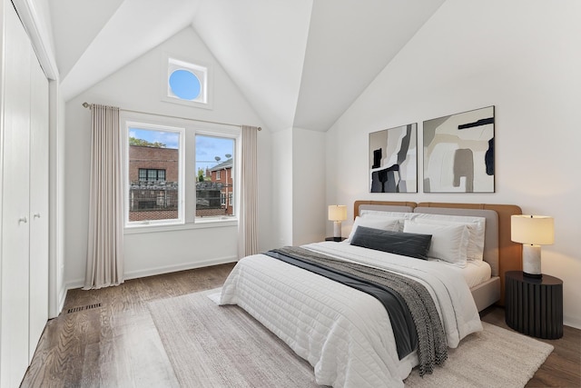 1443 W Wrightwood Ave Unit B, Chicago, IL 60614 - bedroom featuring wood finished floors, baseboards, and high vaulted ceiling