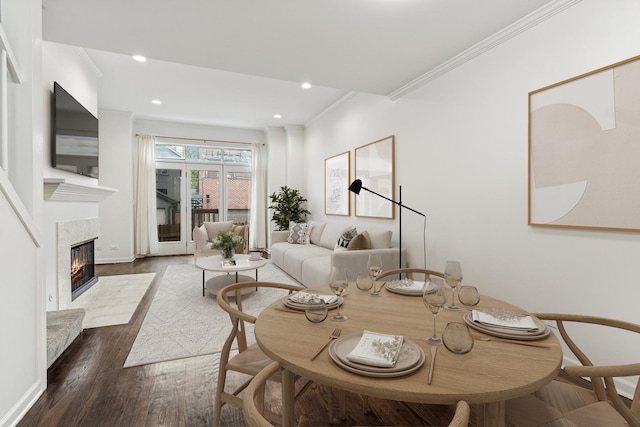 1443 W Wrightwood Ave Unit B, Chicago, IL 60614 - dining area featuring ornamental molding, dark wood finished floors, a tiled fireplace, baseboards, and recessed lighting