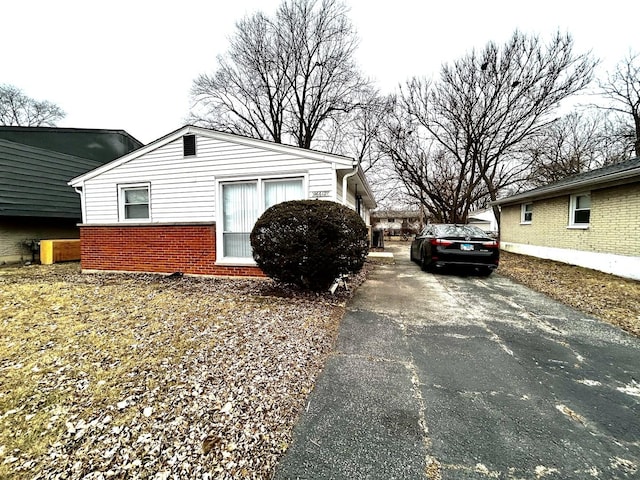 16612 Ashland Ave, Markham, IL 60428 - view of side of property featuring brick siding and asphalt driveway