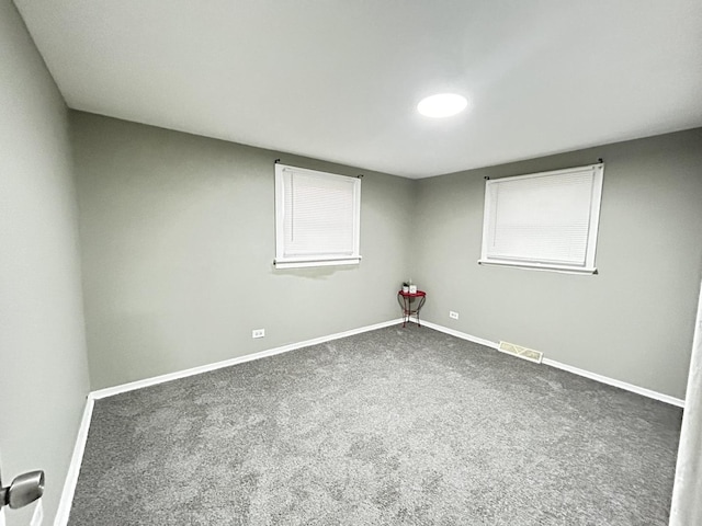 16612 Ashland Ave, Markham, IL 60428 - unfurnished room featuring dark colored carpet and baseboards