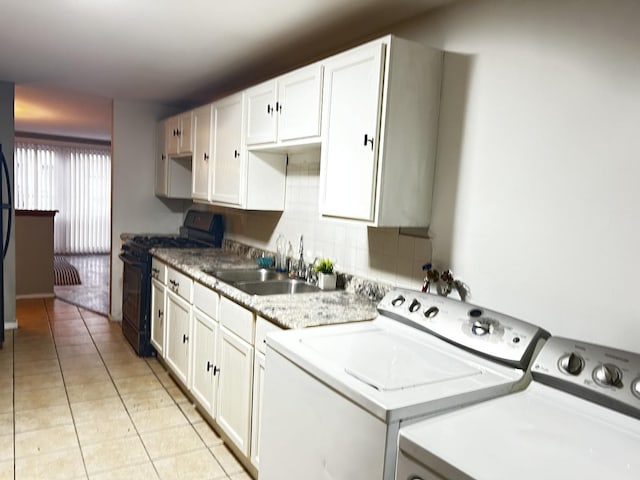 16612 Ashland Ave, Markham, IL 60428 - laundry area featuring washer and clothes dryer and light tile patterned floors